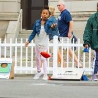 Kids playing bean bag toss